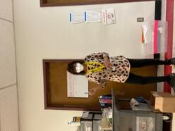 Welcome Center Volunteer, Pnina, inside the center in front of the showers.