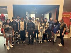 Group of students standing at a college campus