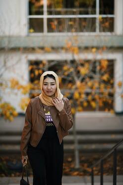 Mansora walks up a set of stairs at Arizona State University.