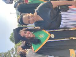 A Youth Futures 2023 graduate and Ms. Debra Nealy smiling for a photo at graduation.