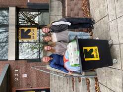 Family dropping off gifts for Light One Candle drive.