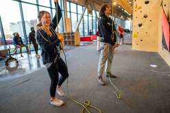 Climbing staff helping refugees