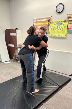 IRC volunteer-turned-staff, McKenna Smith, instructs self-defence class in San Diego
