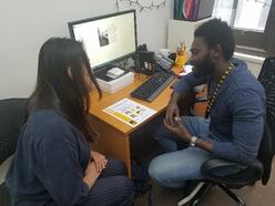 Client talking with the Financial Coach