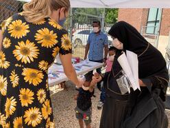 Health team staff taking temperatures outside of the International Rescue Committee in Salt Lake City.
