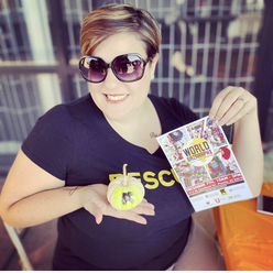 Maria Gigourtaki holding an International Rescue Committee painted pumpkin and pamphlet.