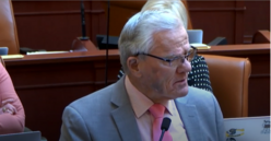 Representative Dan Johnson at the legislative session, speaking and looking focused