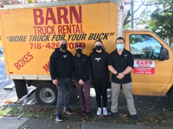 Move in truck behind IRC staff, partners, and volunteers.