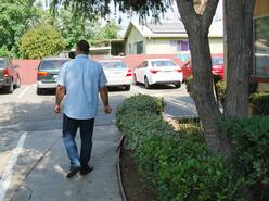 Noor walking near his home