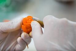 Leila makes carrot roses for Project CHOP platters
