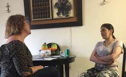 ESL Tutor practice English with refugee as part of new International Rescue Committee program