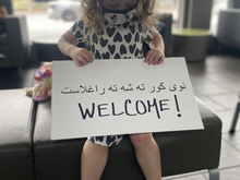 Three-year-old Juniper welcomes Afghans arriving to the United States.