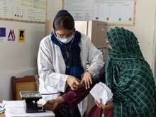 Badshahzadi, checks the blood pressure of 25 year old local resident, Raheela, who is 9 months pregnant with her fourth child at the Maternal, Newborn and Child Health Centre (MNCH).