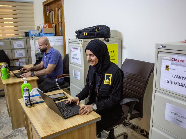 Marwa, a lawyer in IRC Iraq's Protection and Rule of Law (PRoL) team, sits with colleagues in the IRC office in Ramadi, where the atmosphere is one of mutual support.