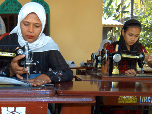 Asnidar (on the left) and Yusnandi are tailors in the village of Pante Gura, Aceh province in western Indonesia—and are some of the main providers of clothes in the village.