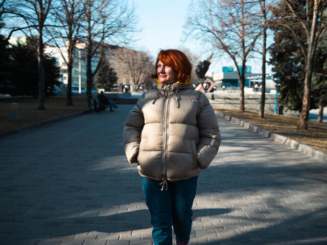Oleksandra walking down a street
