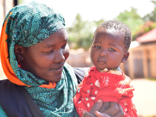 Samia cuddles her youngest daughter Tibiyan, who is just learning to crawl. She hopes both Tibiyan and her other daughter Siminar will grow up to become strong women that give back to others.