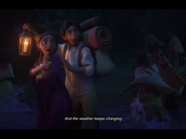 Standing in a river, young Alma holds her triplets while Pedro holds a lantern and carries their belongings on his back. They are looking at something off camera, terrified, and other people are fleeing alongsie them.