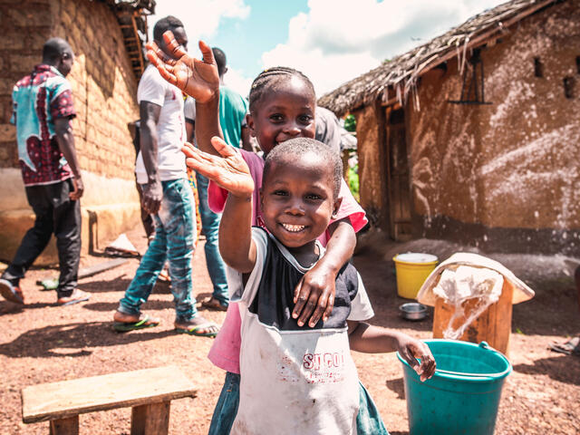 Ivorian children wash their hands