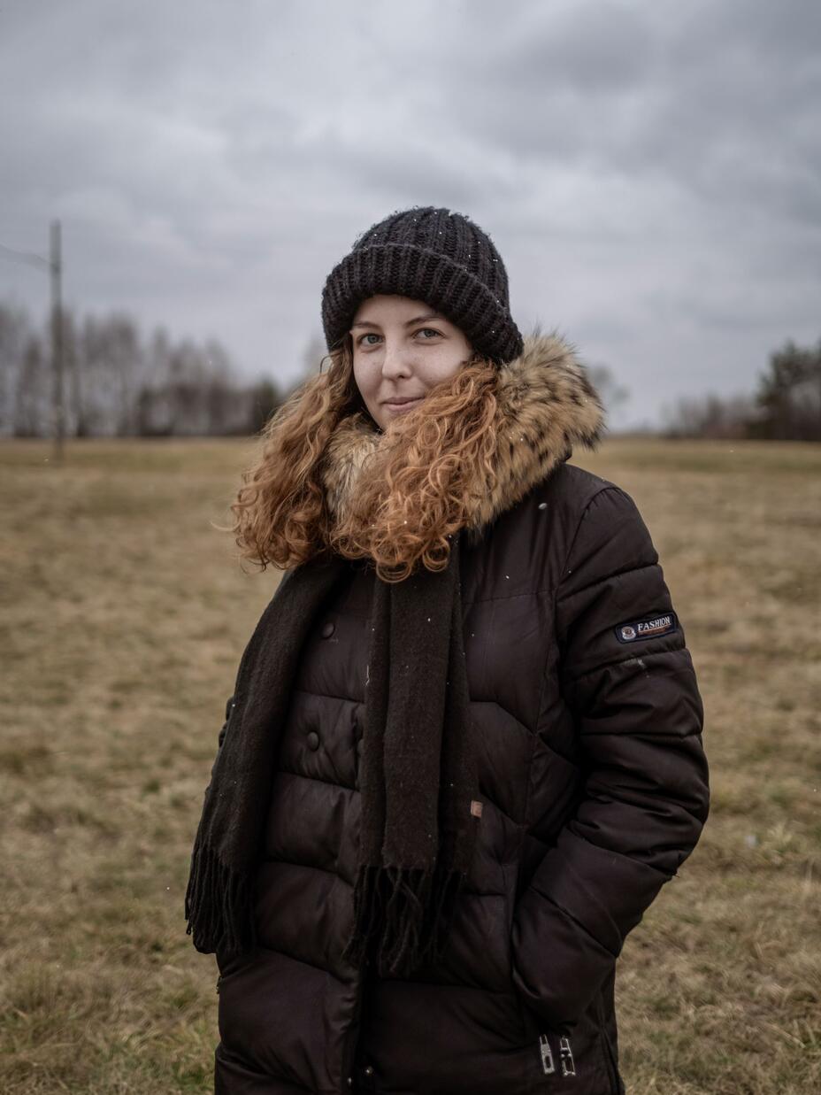 A young woman standing in a field