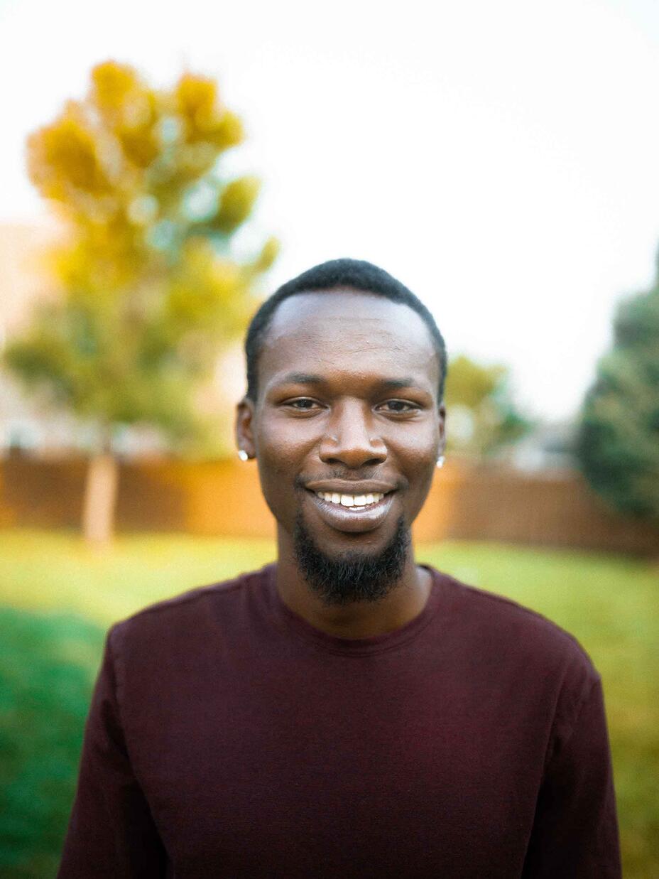 Fredrick poses in the yard of his house in Boise.