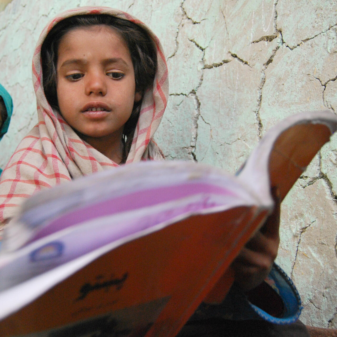 a girl reading in a book