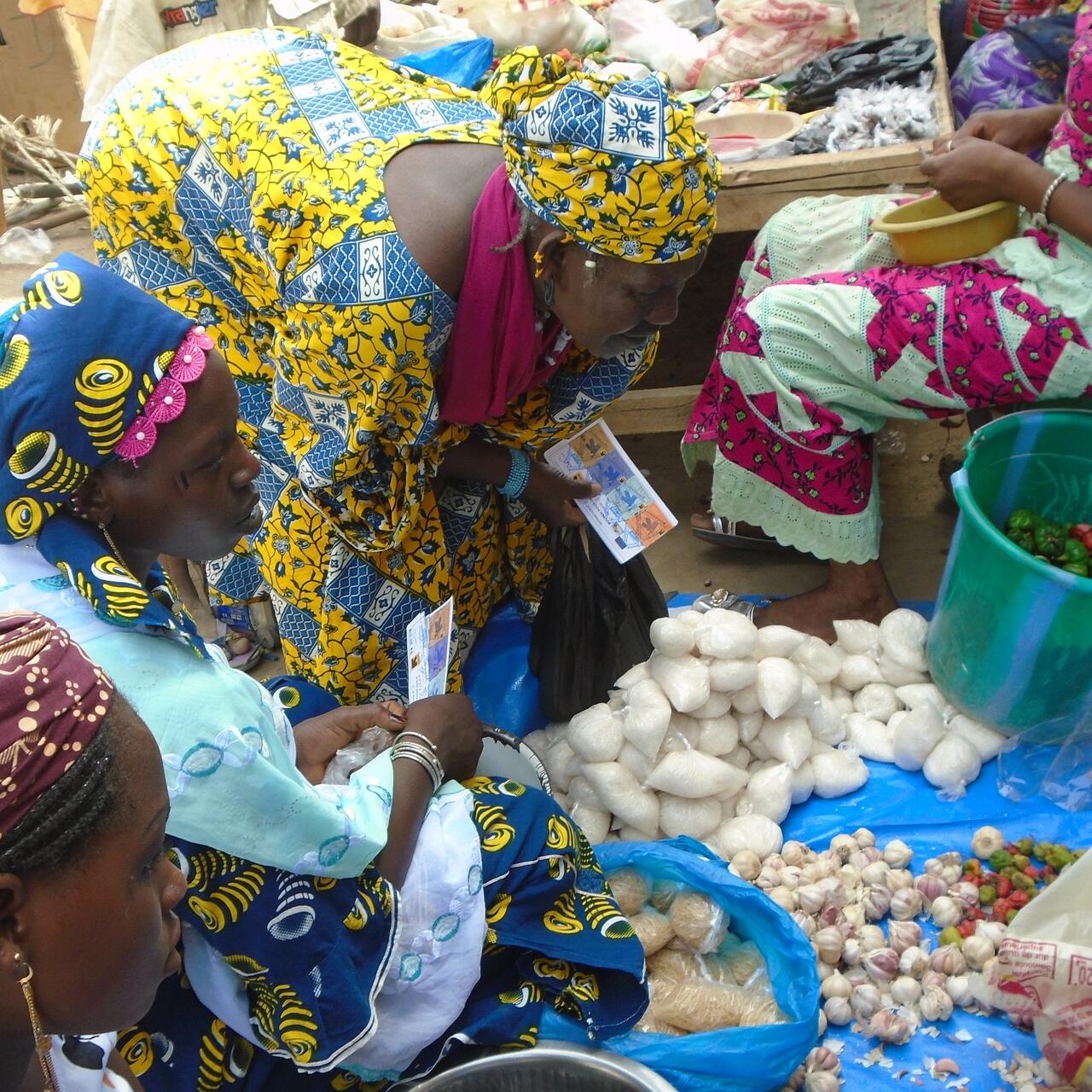 women exchange their food vouchers