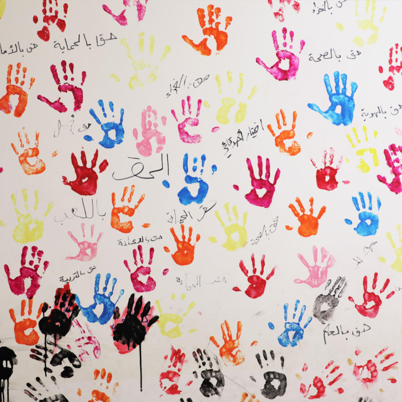 Children's handprints on the walls of the IRC centre in North Lebanon