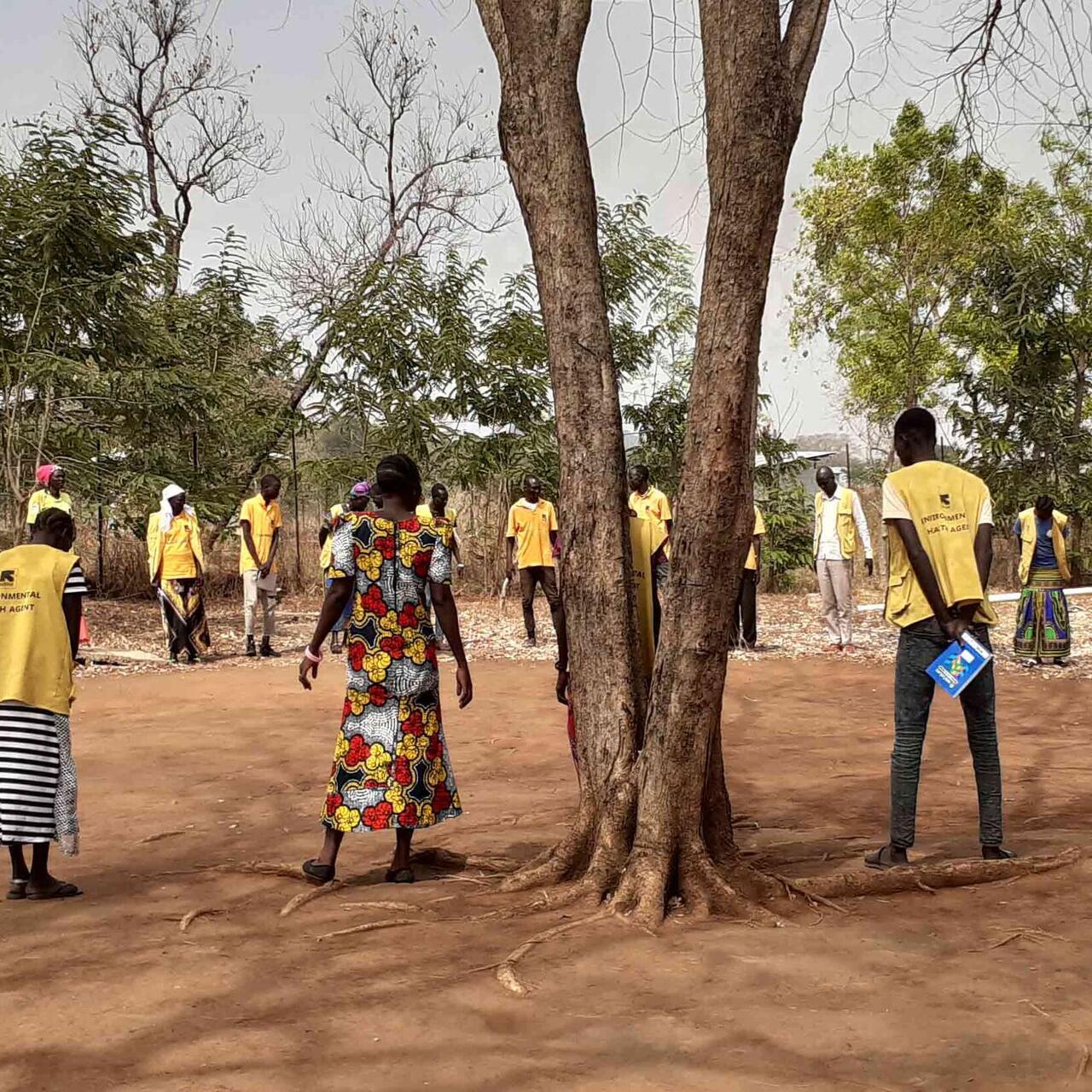IRC staff members standing in a field in a circle (Ethiopia)
