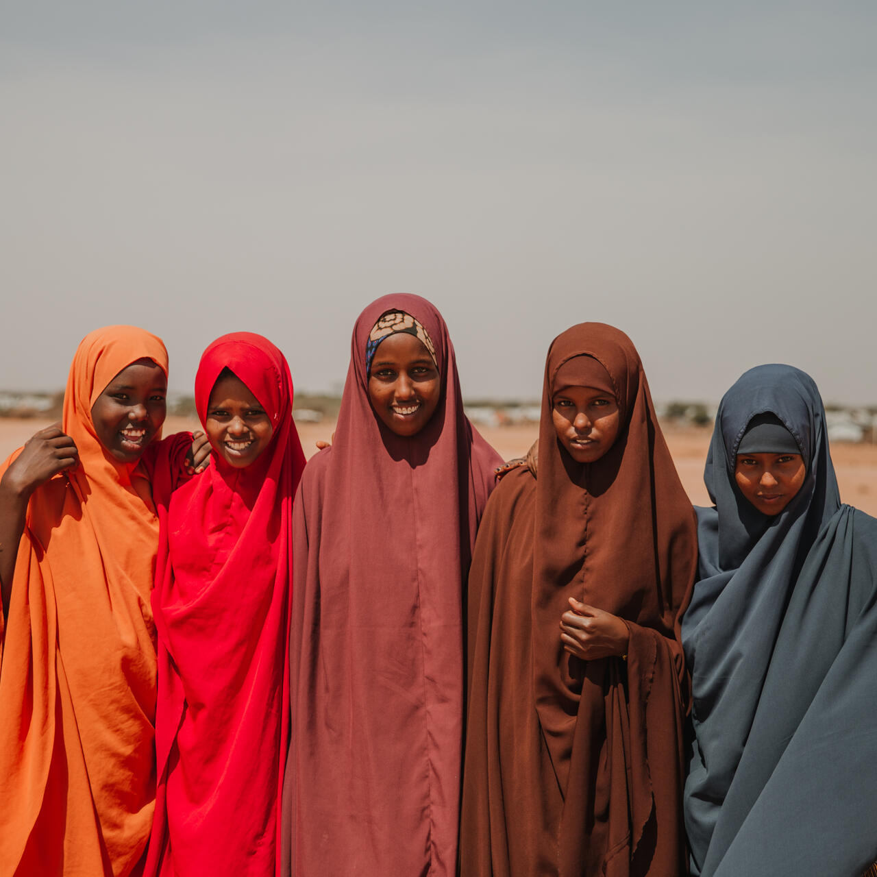 A group of five girls standing together
