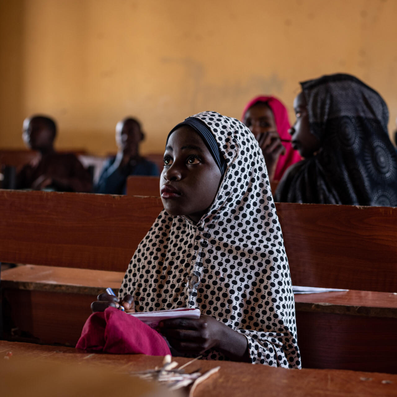 Fatima sitting in a classroom