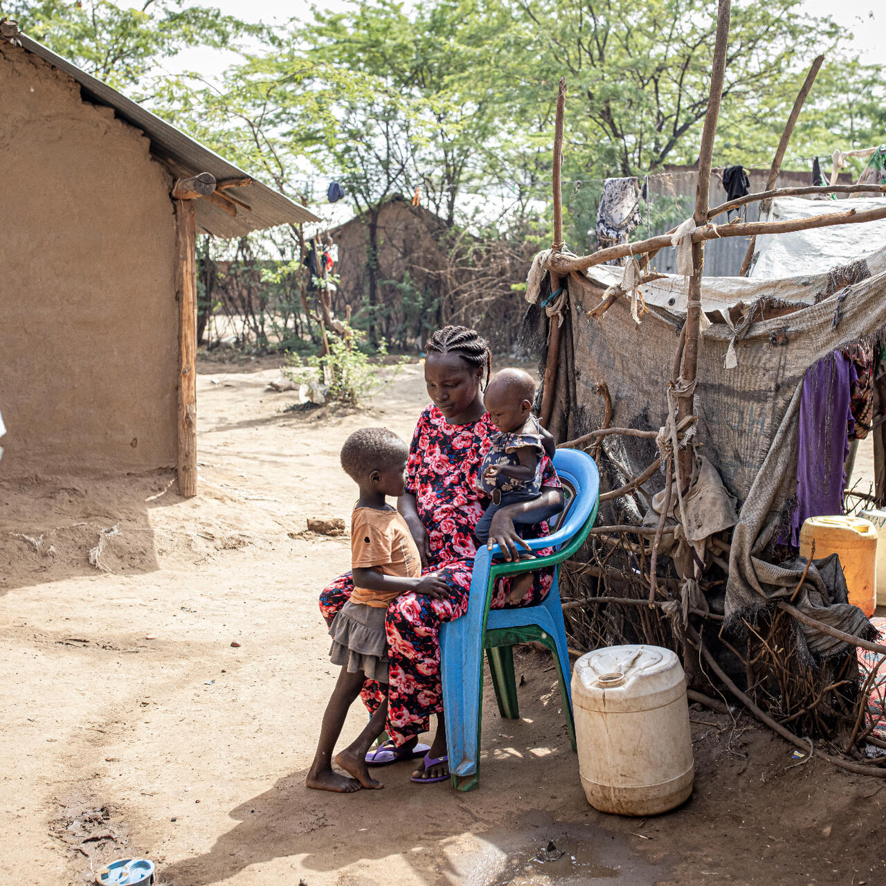 Judith, who has been living in a Kenyan refugee camp since 1998 sits with her two children and explains how drought has made life more difficult.