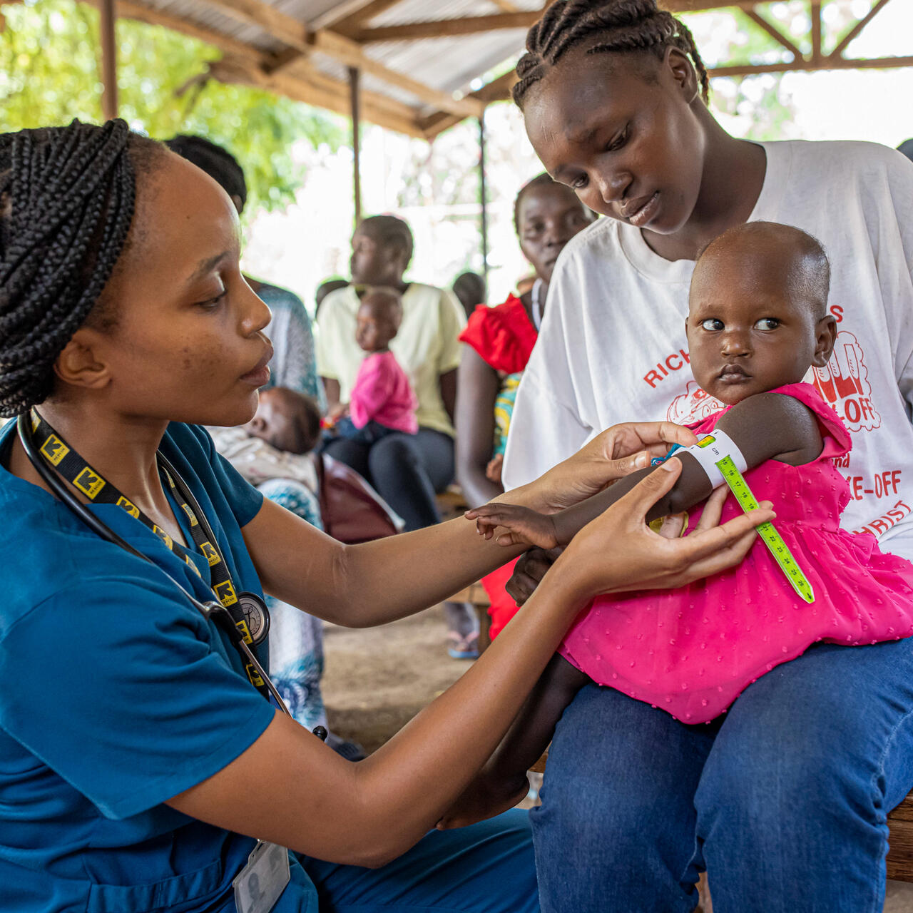 Dr. Sila Monthe, 29, health manager for IRC at Kakuma, checks Vanessa,1, for malnutrition at Locher Angamor Health Dispensary in Kakuma Refugee Camp.