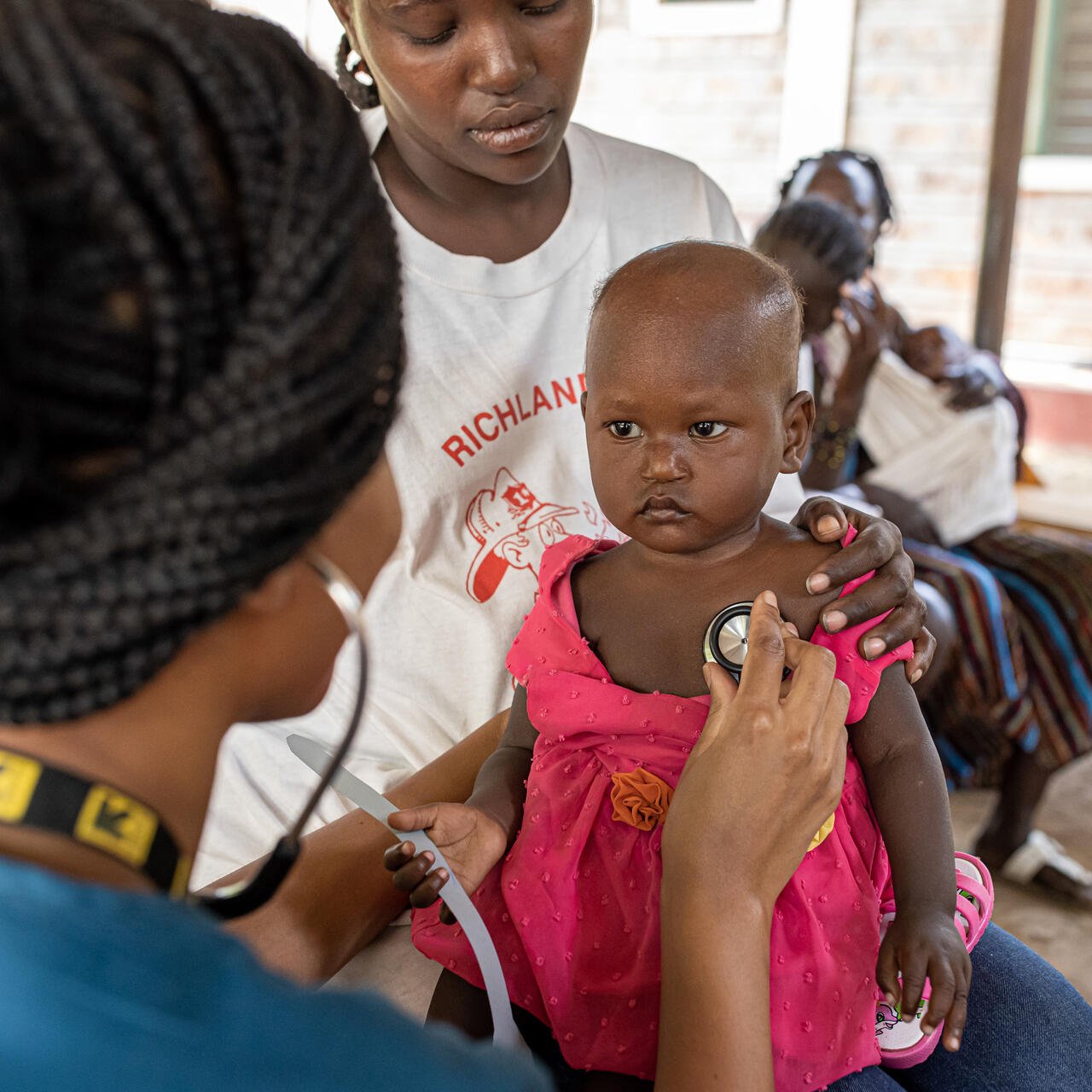 Dr. Sila Monthe, 29, health manager for IRC at Kakuma, checks Vanessa,1, for malnutrition at Locher Angamor Health Dispensary in Kakuma Refugee Camp.