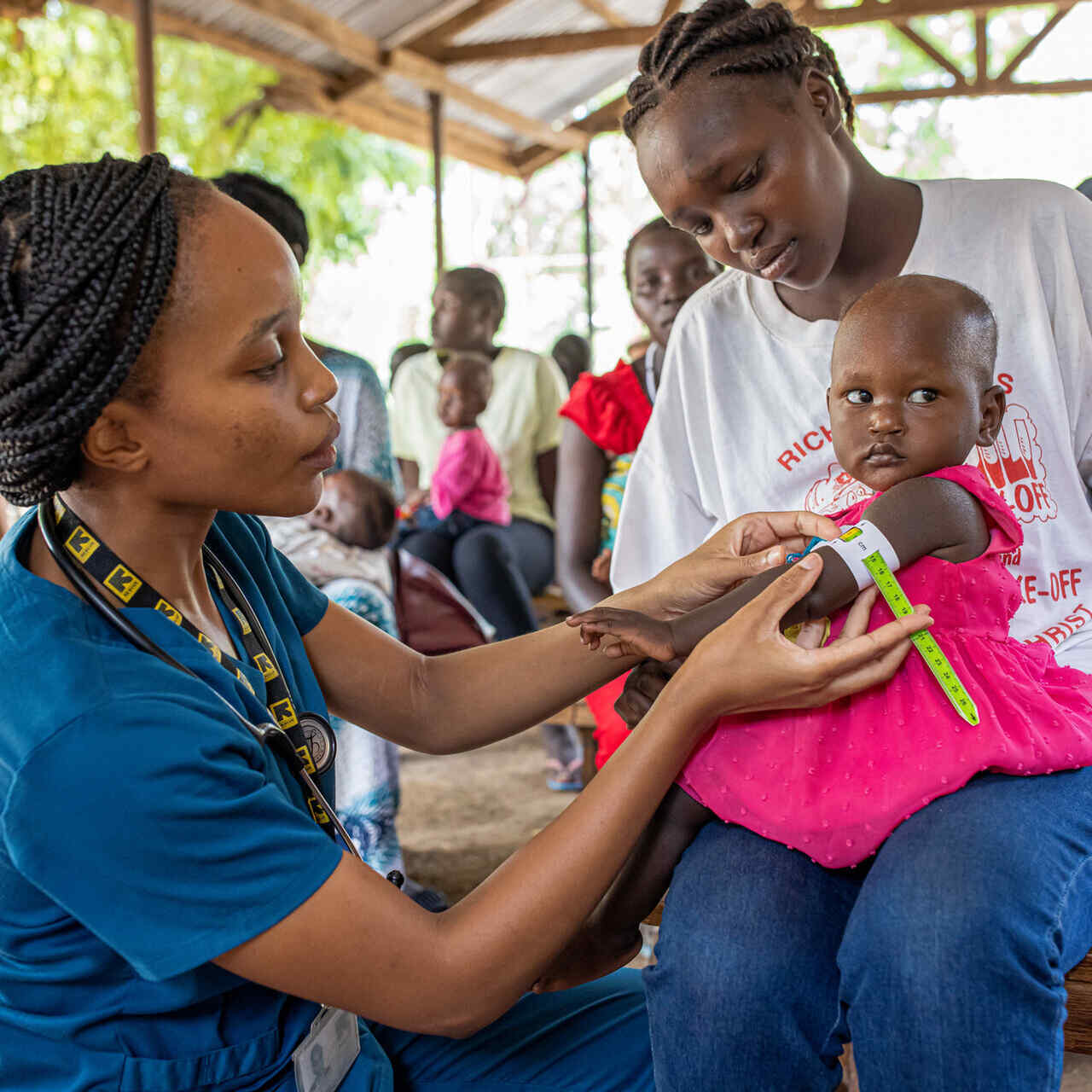Dr. Sila Monthe, 29, health manager for IRC at Kakuma, checks client for malnutrition at Locher Angamor Health Dispensary in Kakuma Refugee Camp.
