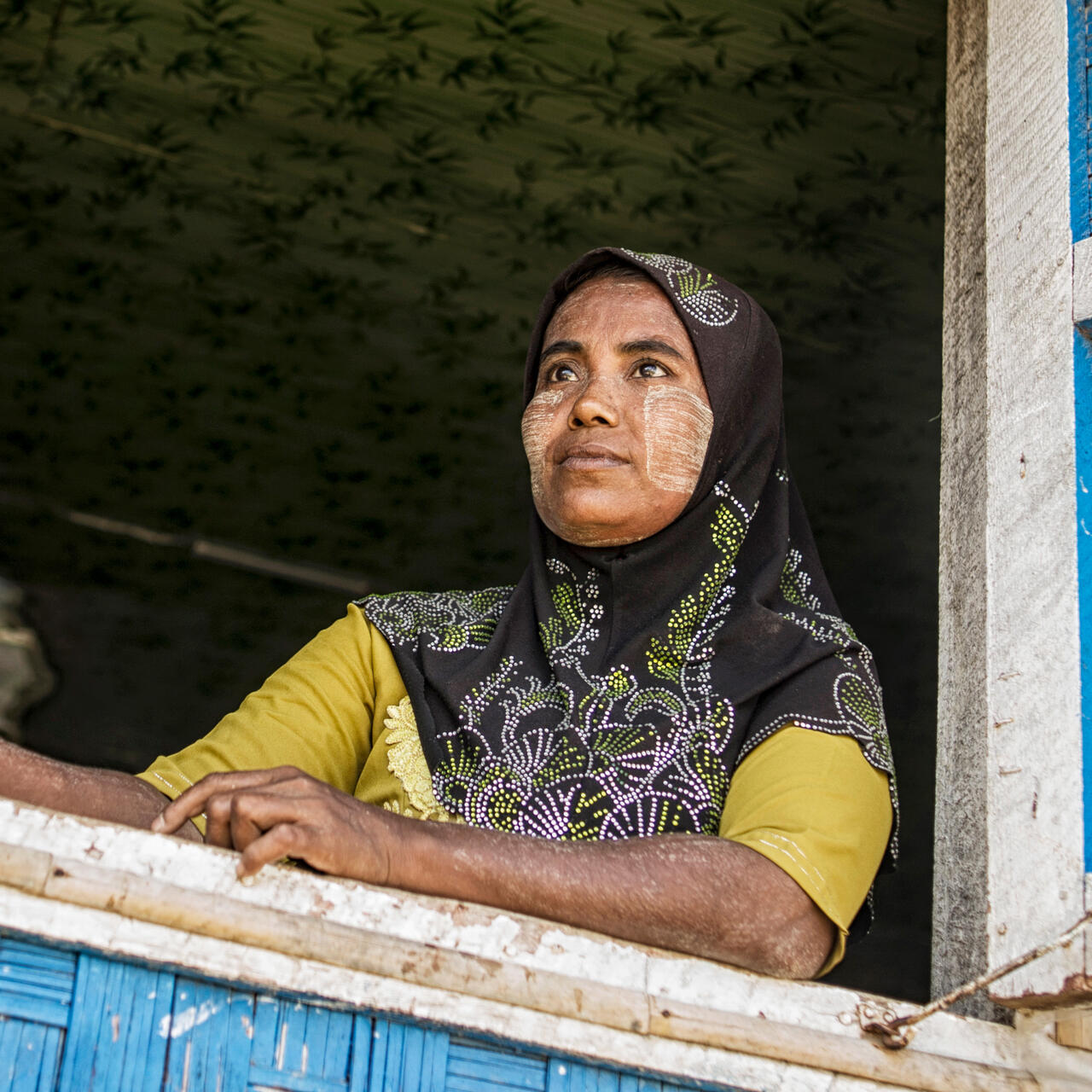A woman poses for a photo in Myanmar.