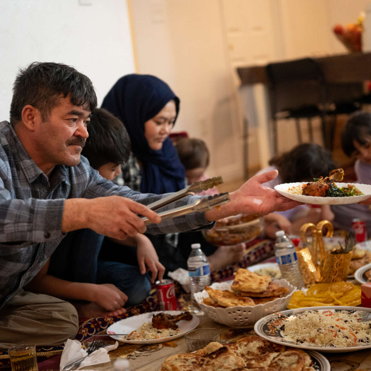 The Hussaini family enjoy an Iftar meal.