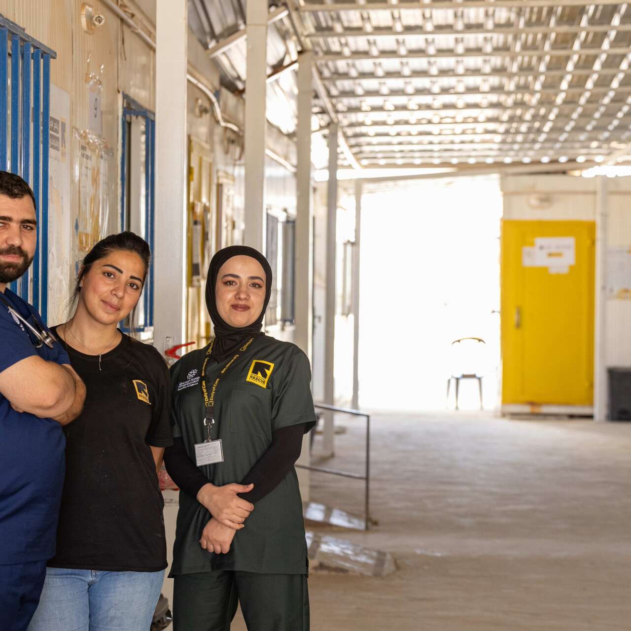 Duha and her colleagues pose together for a photo outside of the IRC's medical clinic in the Za'atari refugee camp.