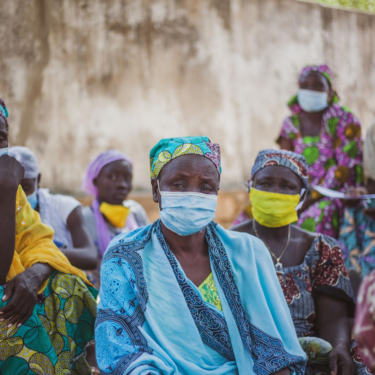 A group of women wearing face masks
