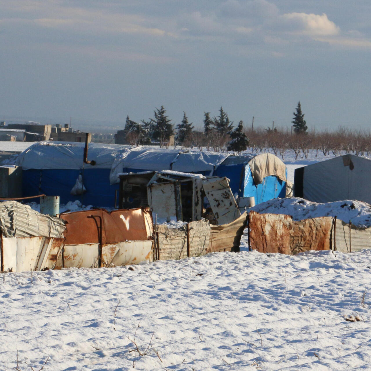 A line of tents in the snow
