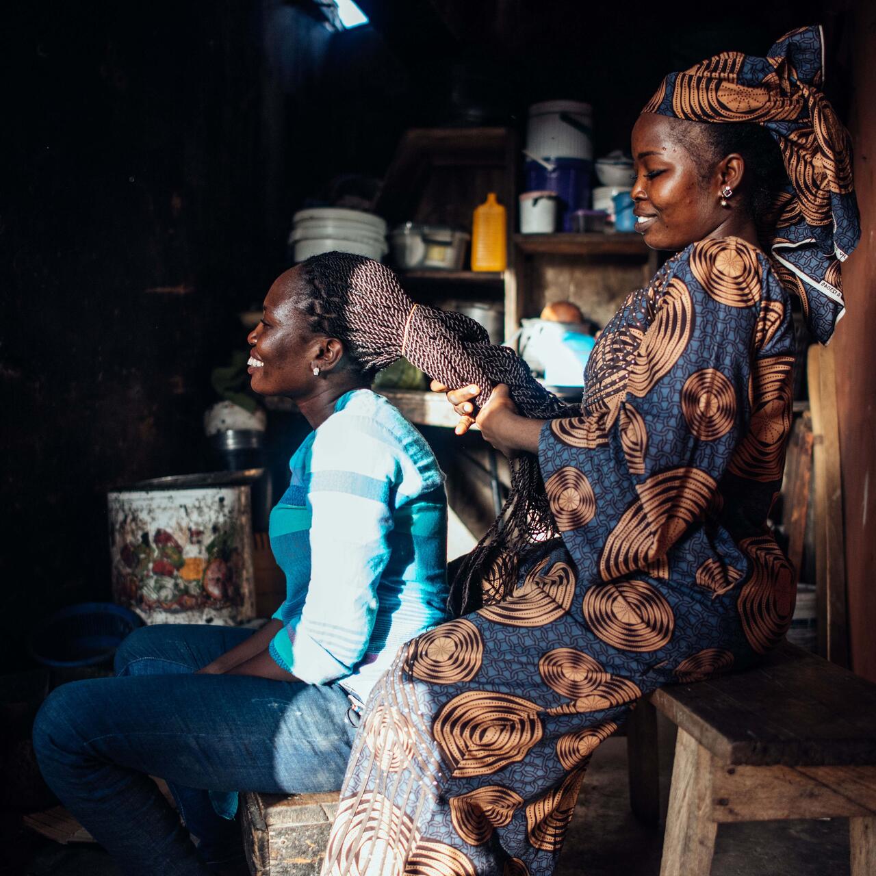 Hairdresser Abigail styles a customers hair.