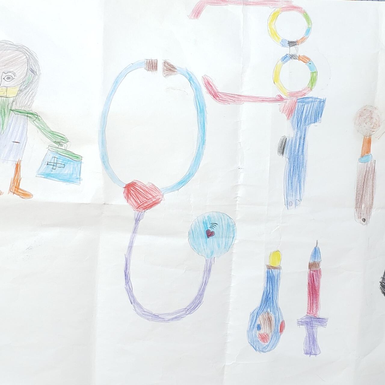 Eight-year-old Delina's drawing of a doctor and her instruments, including a stethoscope and a syringe