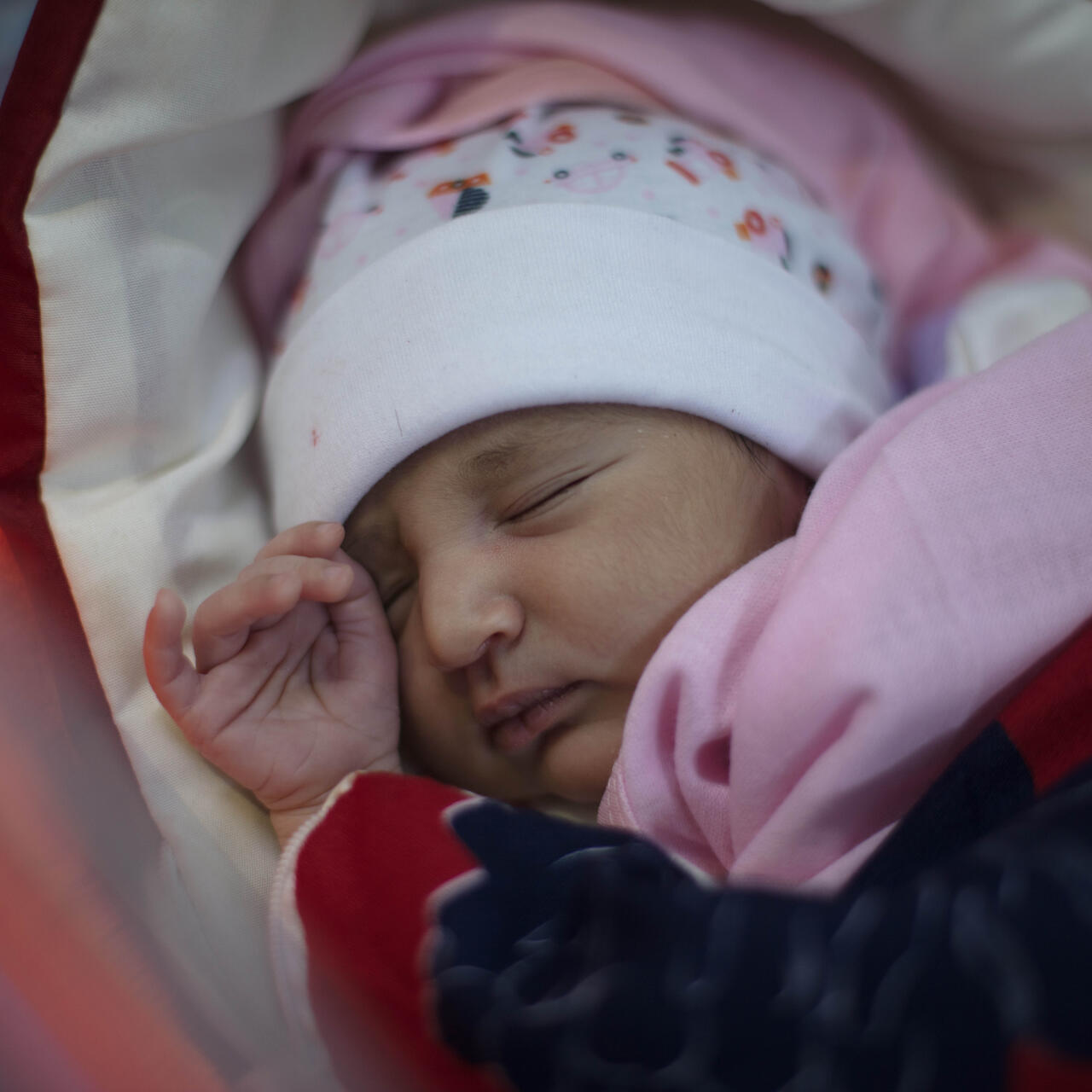 Newborn baby Mera sleeps in an IRC health center in Yemen.