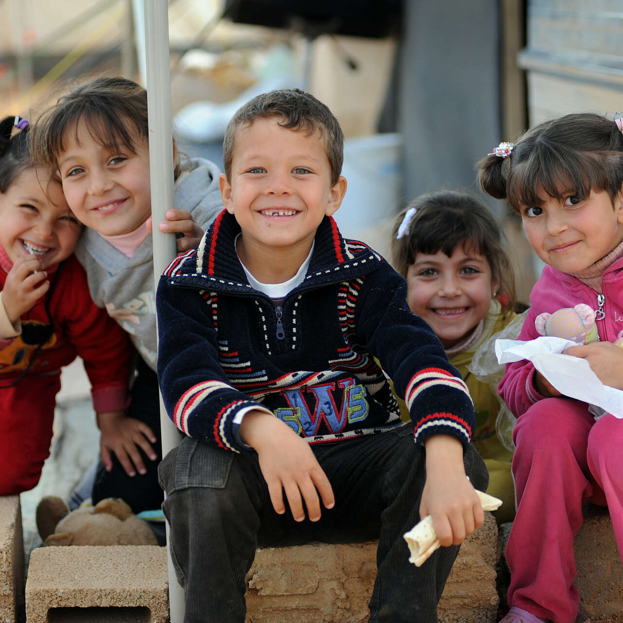 Osama, himself a refugee, volunteers with the IRC to support Syrian children who cross into Jordan without a parent or guardian.