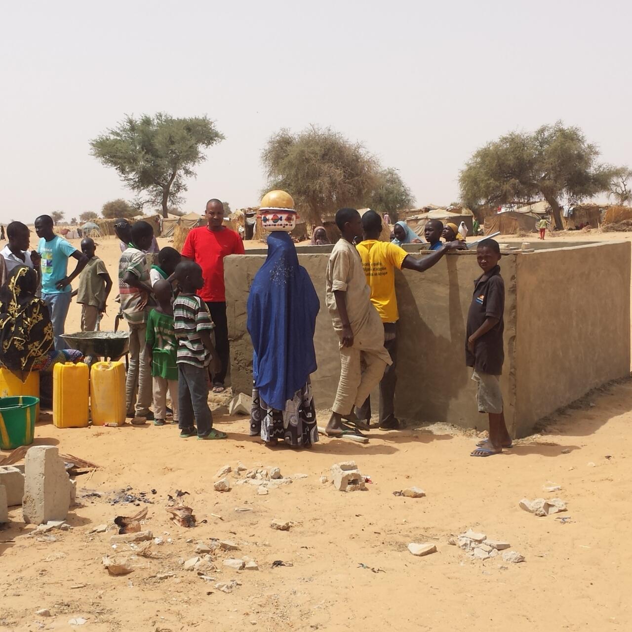 Villagers in Diffa line up to collect water from one of three water wells the IRC constructed.