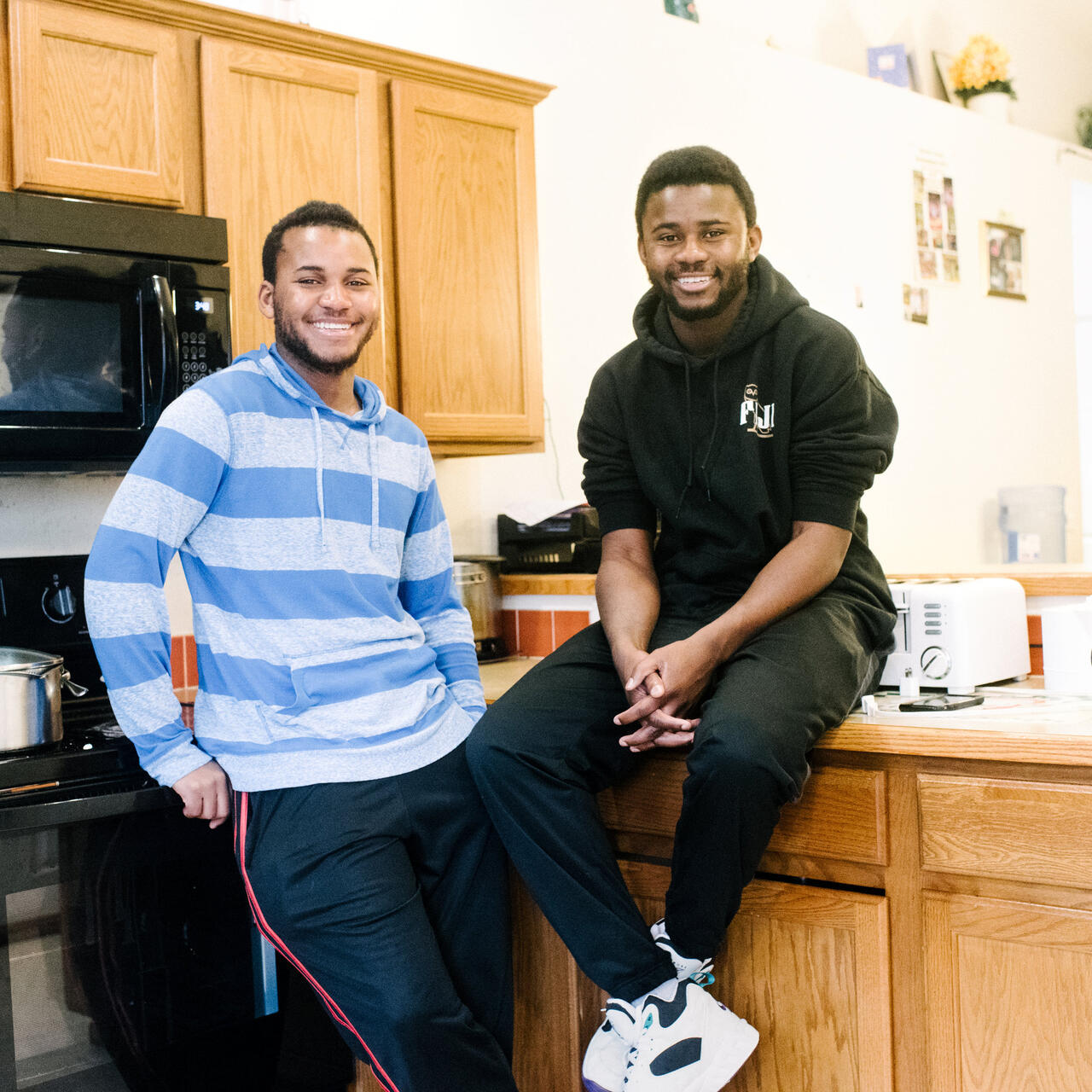George and Patrick in their kitchen at home.
