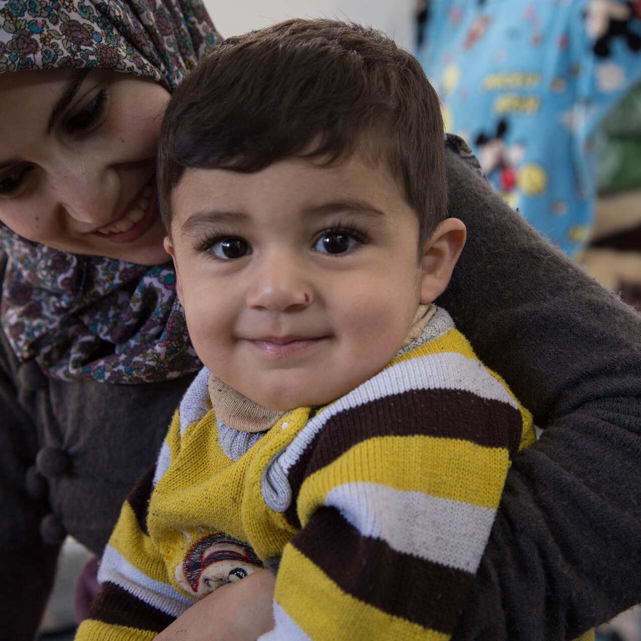 Two-year-old Khaled with his mother