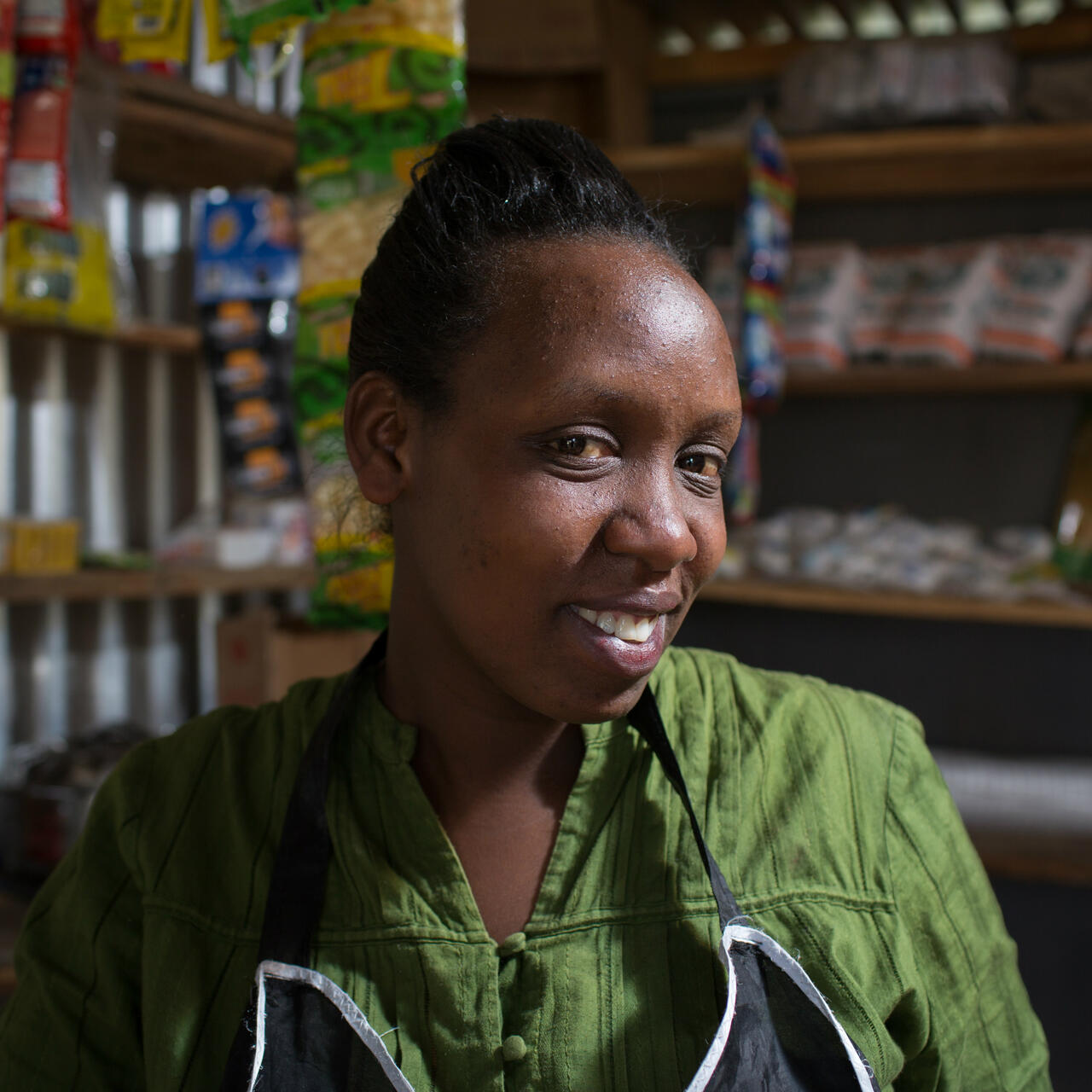 Chantal Rutonda Nyamuco inside the roadside stand where she sellsmandazi bread