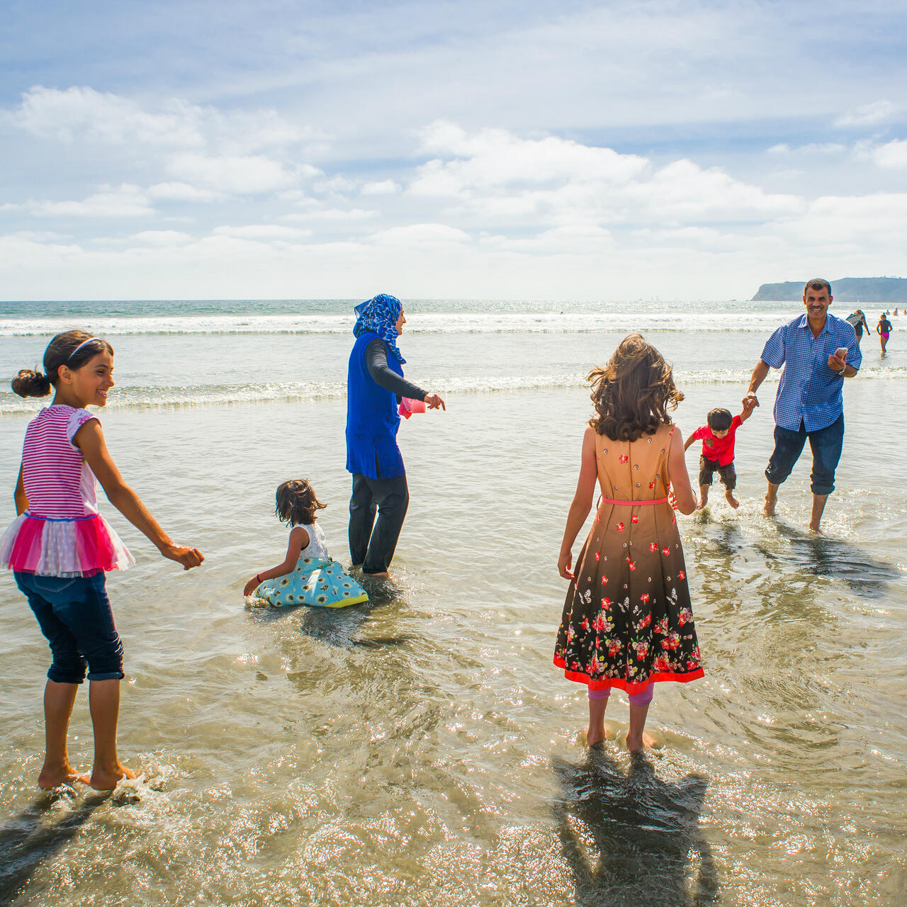 The Tlas family from Syria on a California  beach