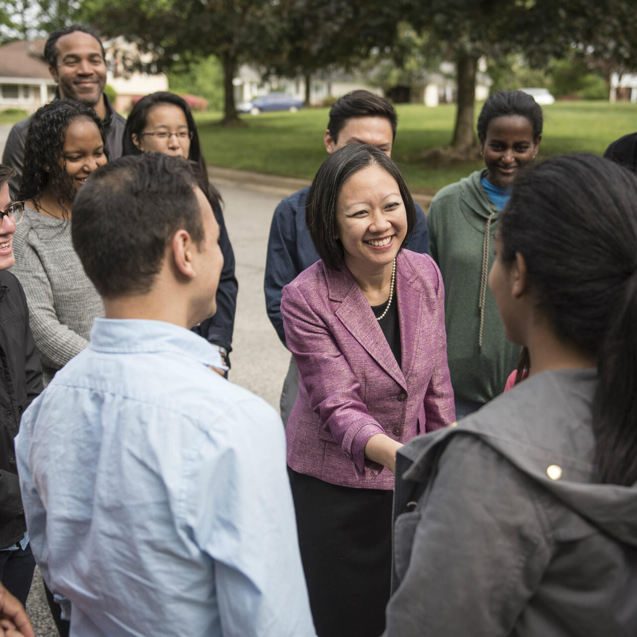 Kathy Tran shakes hands with voters in Virginia